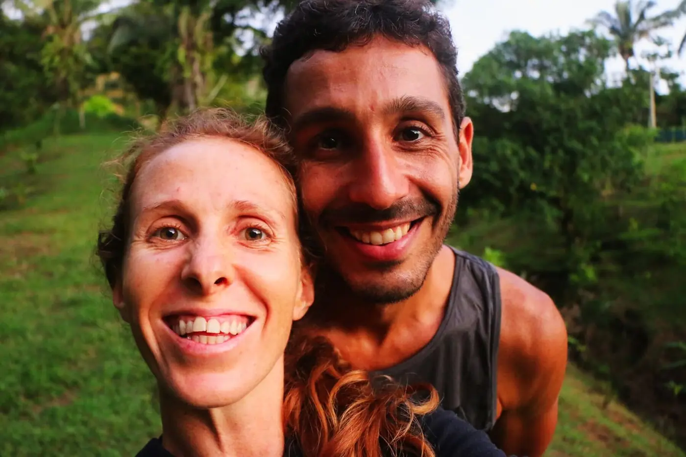 The two founders of Açaí Family smiling on their land in Uvita